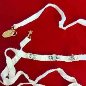 Rada Pearl Swarovski on the white cloth necklace